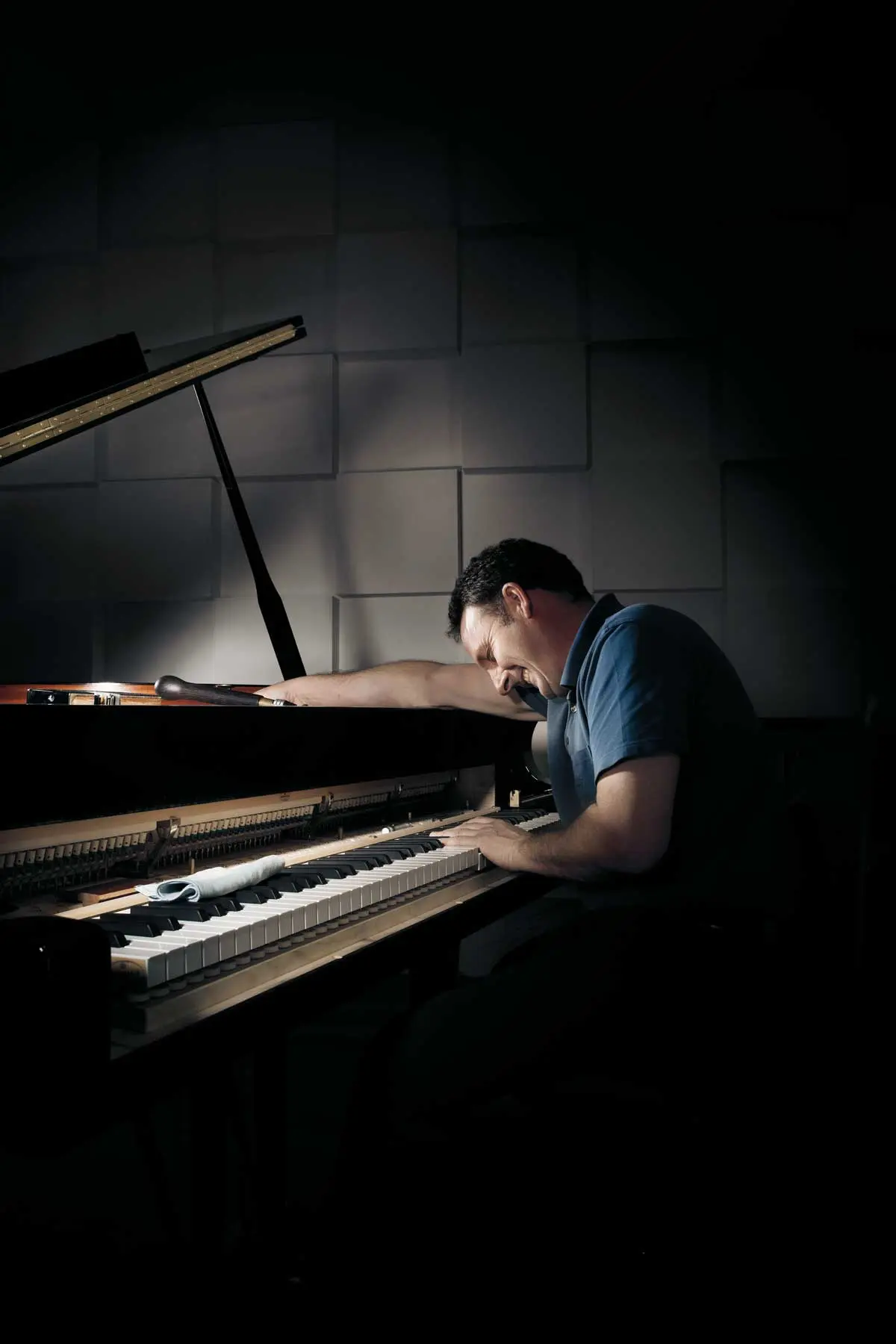 happy man playing piano